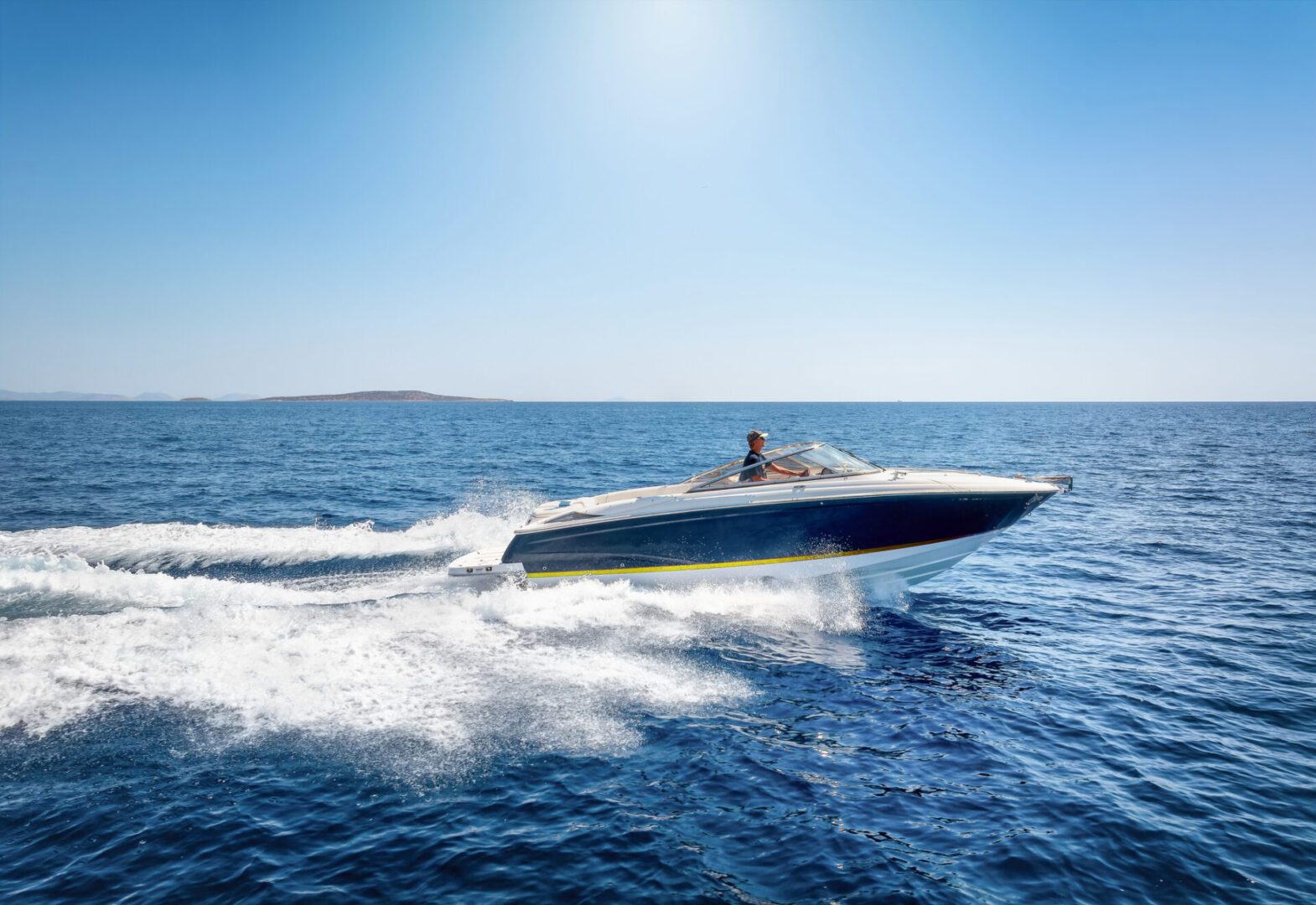 Person driving a motorboat on water